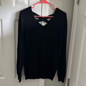 Black long sleeve sweater with Criss Cross open Top Back. Size Large.